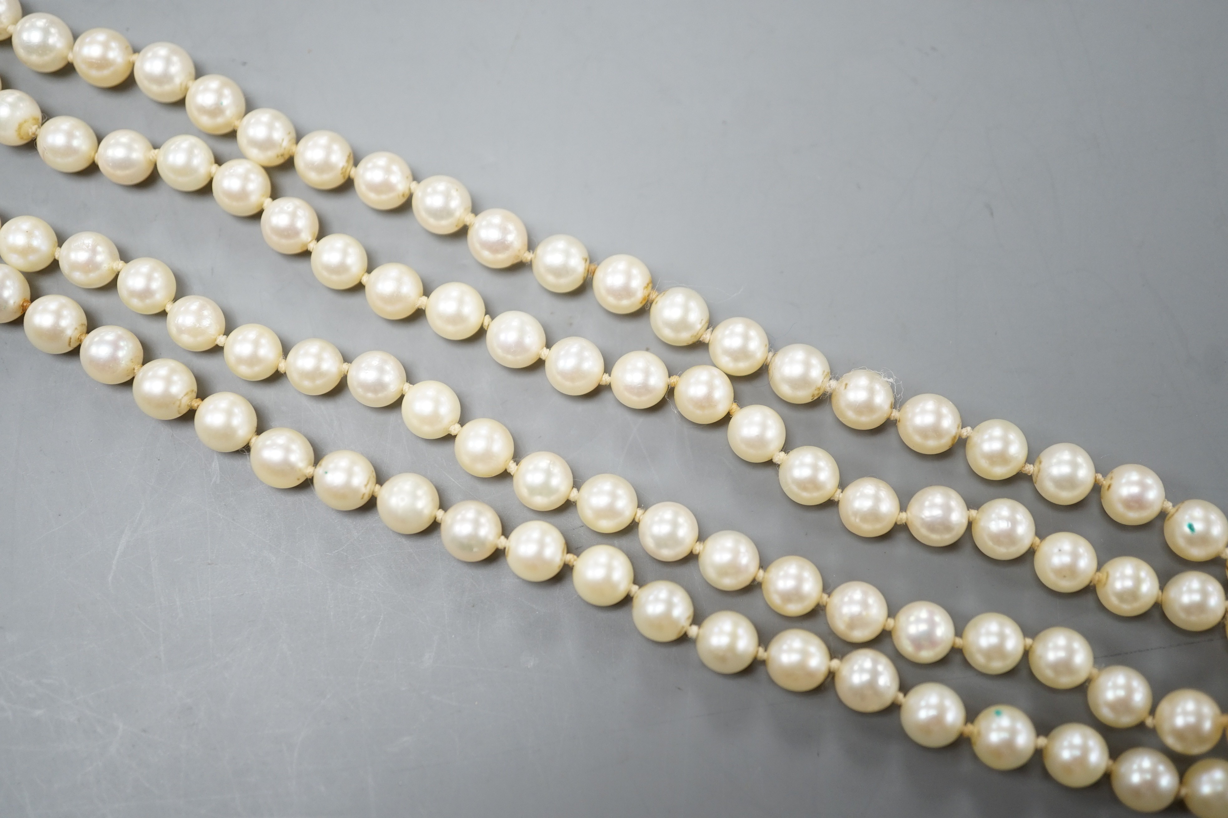 A long single strand cultured pearl necklace with cultured pearl set 9ct white gold clasp, 75cm.